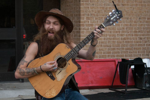 Tyler Gregory, a street musician at the 2013 Busker Festival.