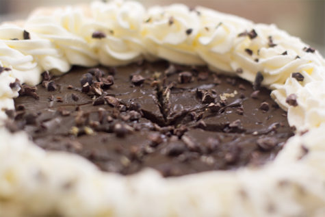 A chocolate cream pie in the display case cooler. Because of their staggered production scheduled, this pie took four days to complete.