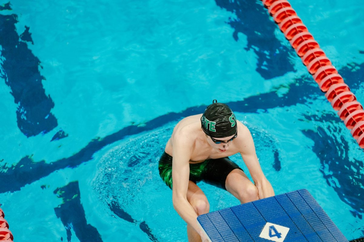 Sophomore Cooper Trummel prepares for the 100 yard backstroke.