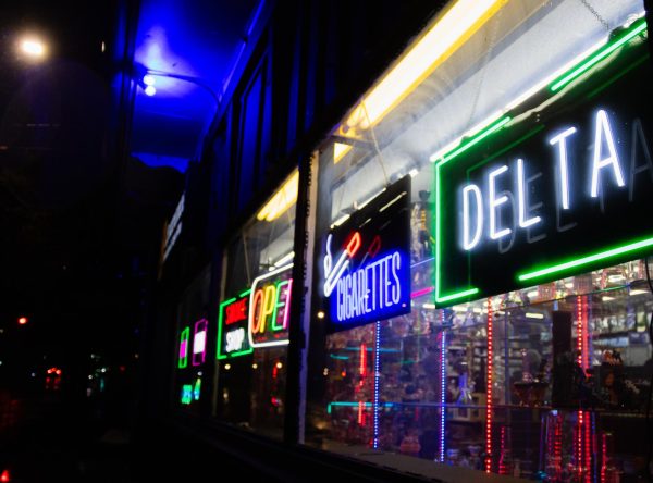 A neon green light titled "Delta" shines out the window of the Lawrence Tobacco and Vape Shop located at 8. W 9th St. The store is located a block away from downtown Lawrence, easily able to pick up foot traffic during the day.

"There are a lot in town but I know some smoke shops that won't ask for my ID from me or my friends when we go. I go to the ones that will get me what I want, plus most are cheap and easy," an anonymous senior said.