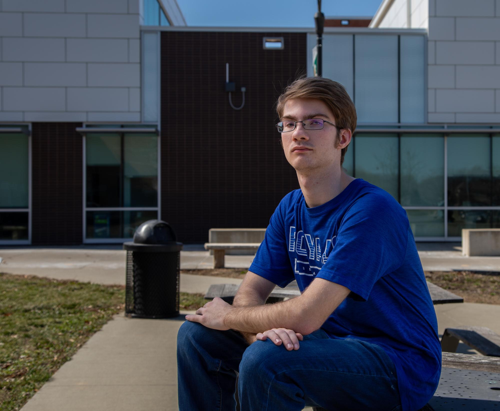 Sitting outside Free State, junior Alex Kerr thinks about his potential term as City Commissioner.