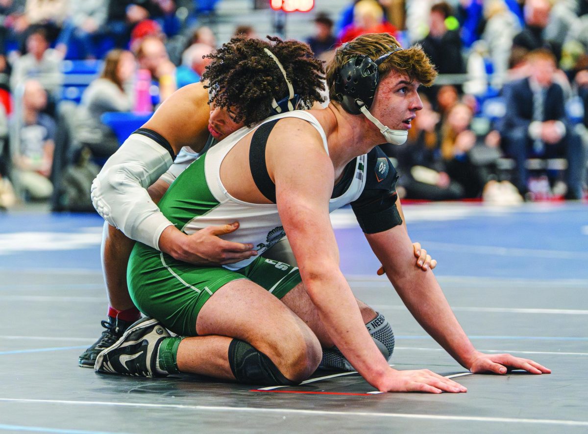 Looking at the referee, senior Blaine
Larkin prepares to continue his match at
KSHSAA 6A State Competition on March 1.